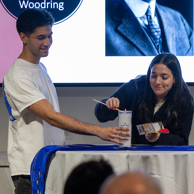 Students lighting candle